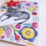 Black Cat Napping on Book Greeting Card by Honeyberry Studios