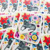 Black Cat Napping on a Book Sticker by Honeyberry Studios