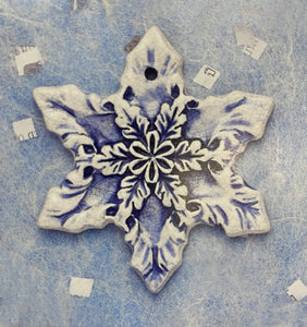 Snowflake V Ceramic Ornament by Mary DeCaprio